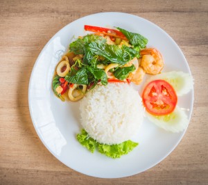 Spicy fried basil leaf with seafood and rice - soft focus point